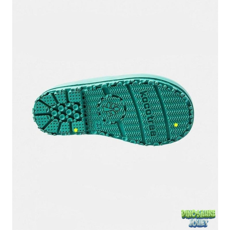 Dinosaure vert bottes jaunes