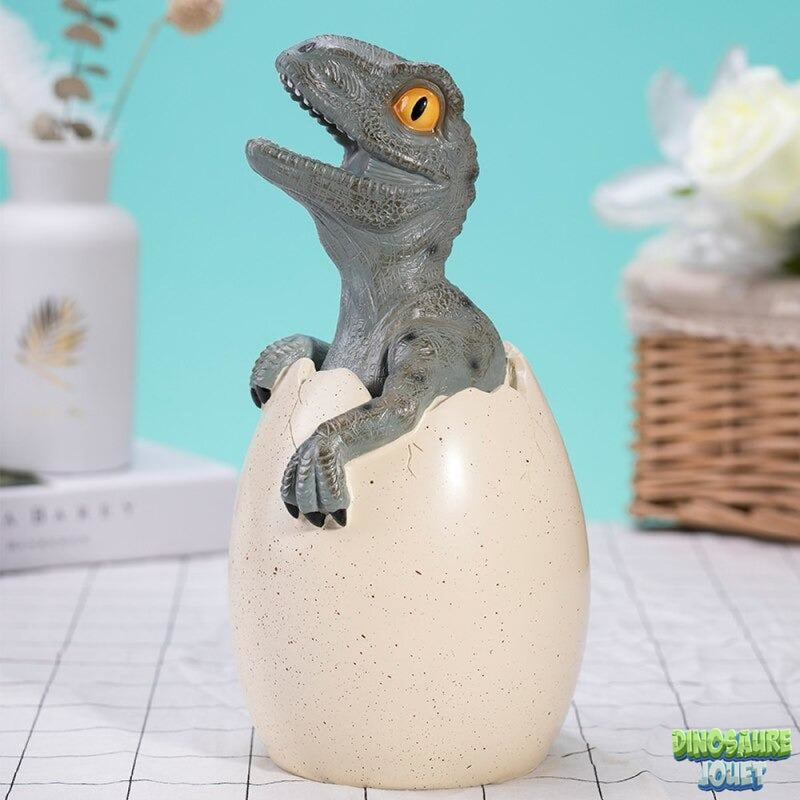 Tirelire dinosaure bébé Vélociraptor